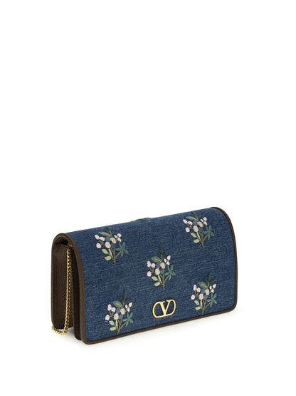 VALENTINO GARAVANI Mini VLogo Signature Shoulder Bag in denim with floral embroidery