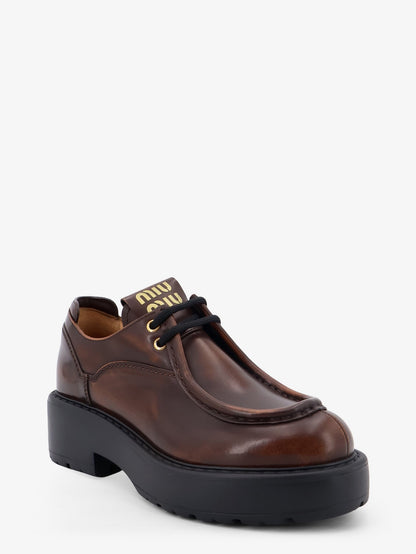 Miu Miu Leather lace-up with front lettering logo - Bruciato