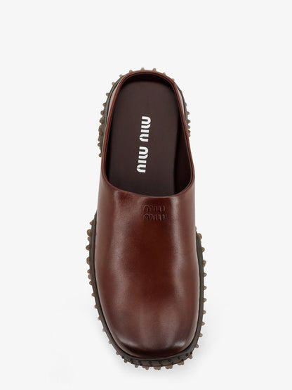 Miu Miu Leather sabot with embossed lettering logo - Caffe