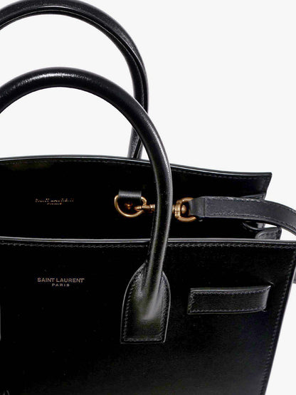 Saint Laurent Baby Sac de Jour leather handbag with padlock - Nero/Nero