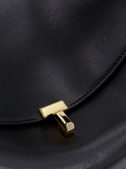 Toteme T-Lock leather crossbody bag - Black