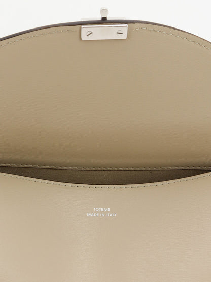 Toteme T-Lock hammered leather crossbody bag - Fawn