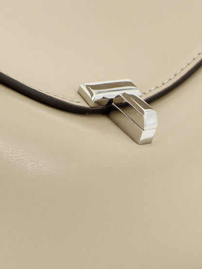 Toteme T-Lock hammered leather crossbody bag - Fawn