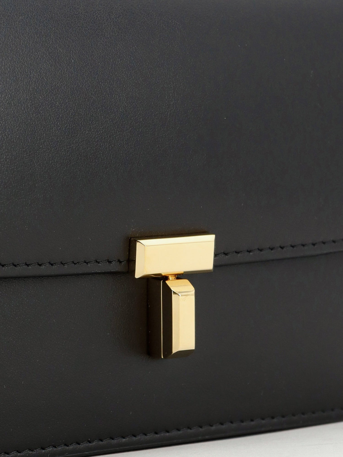 Toteme T-Lock leather crossbody bag - Black