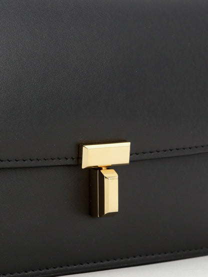 Toteme T-Lock leather crossbody bag - Black