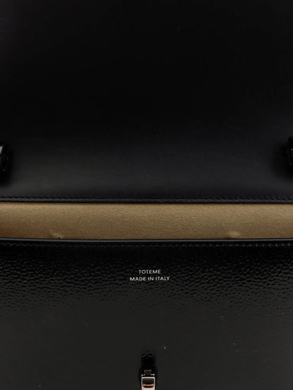TOTEME - Patent T-Lock crossbody bag