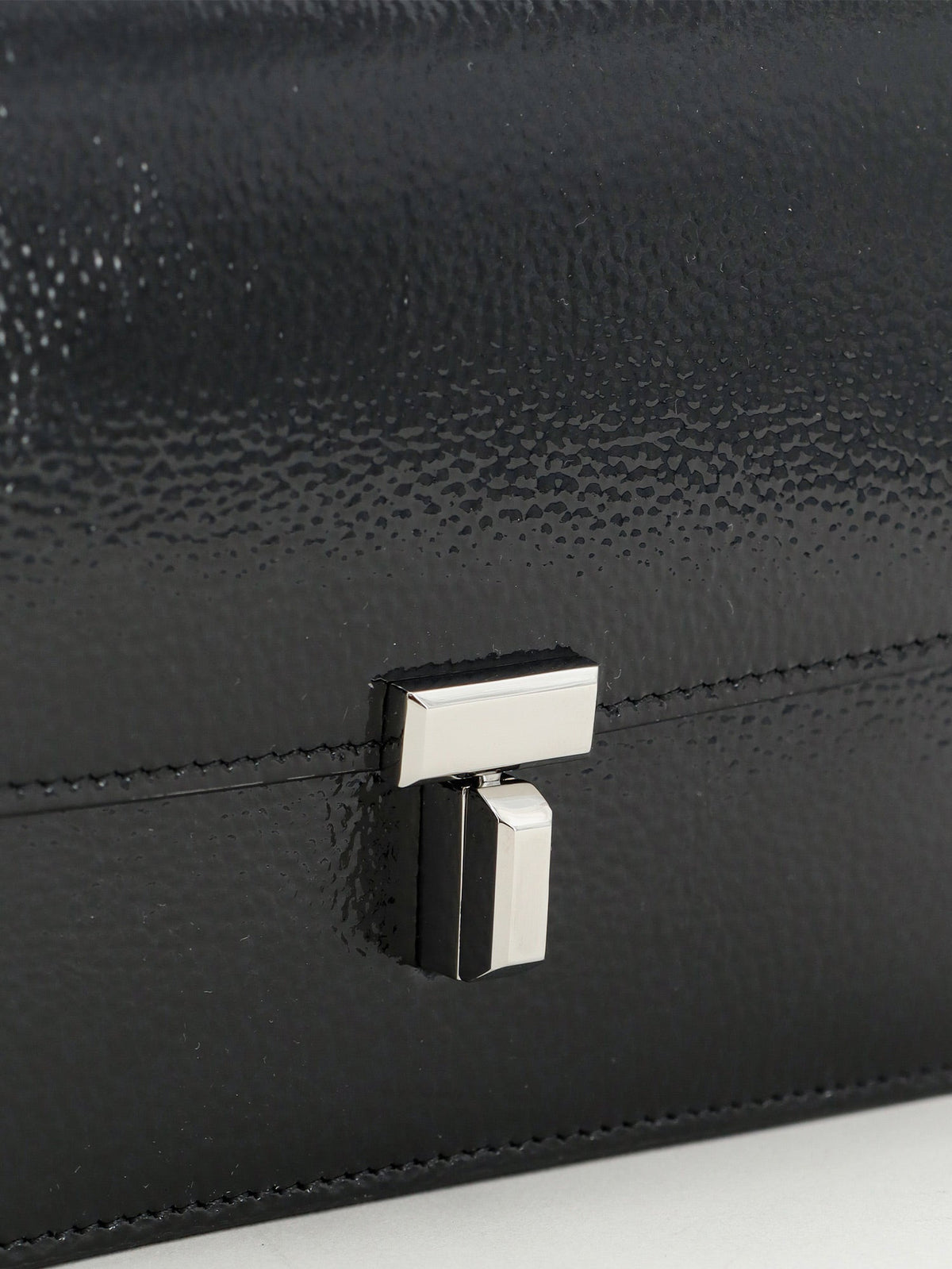Toteme Patent T-Lock crossbody bag - Black