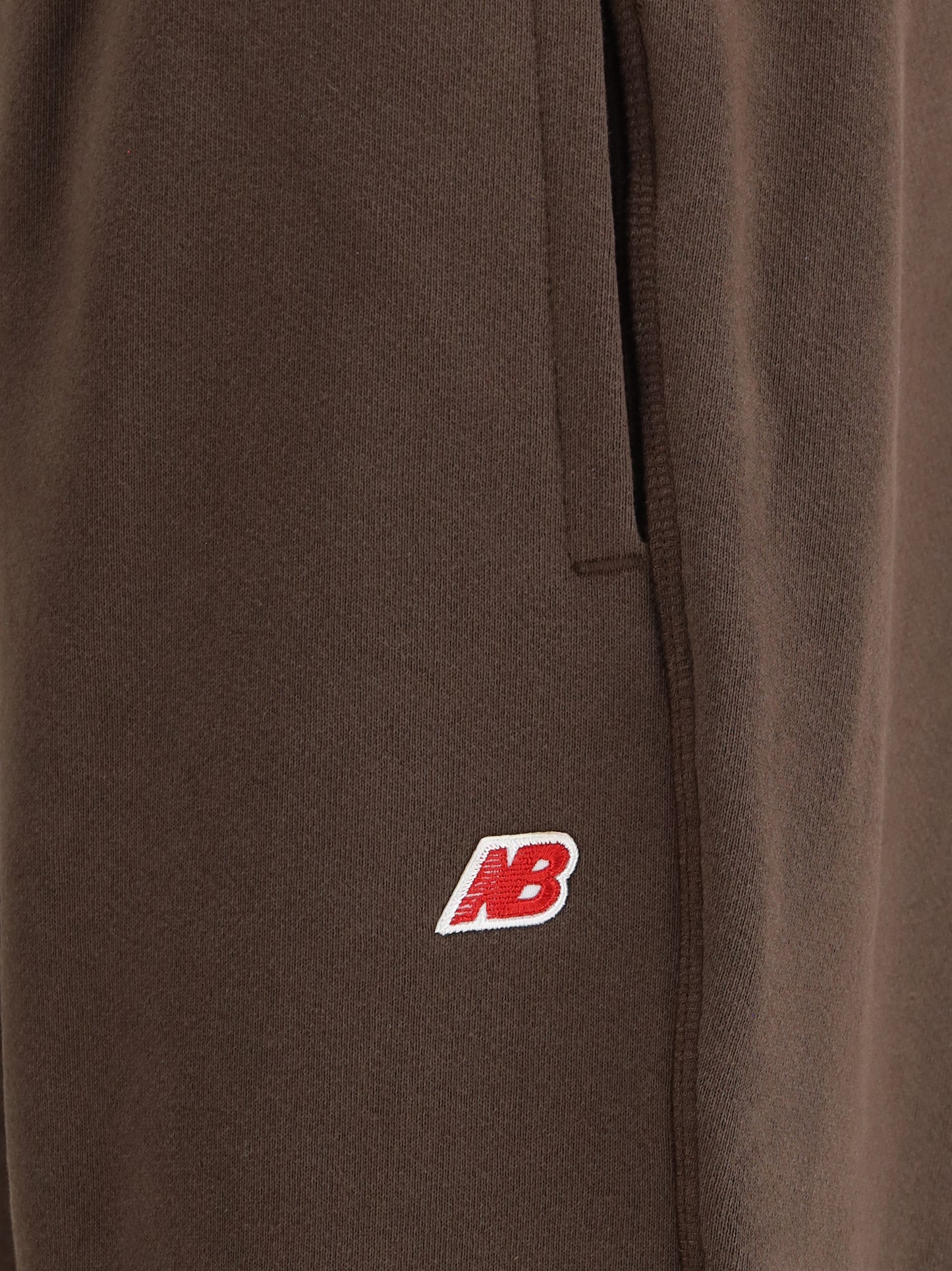 NEW BALANCE Elastic-waistband logo-patch track Pants