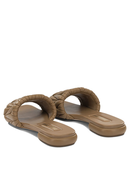 Miu Miu Matelassé leather slides - Brown