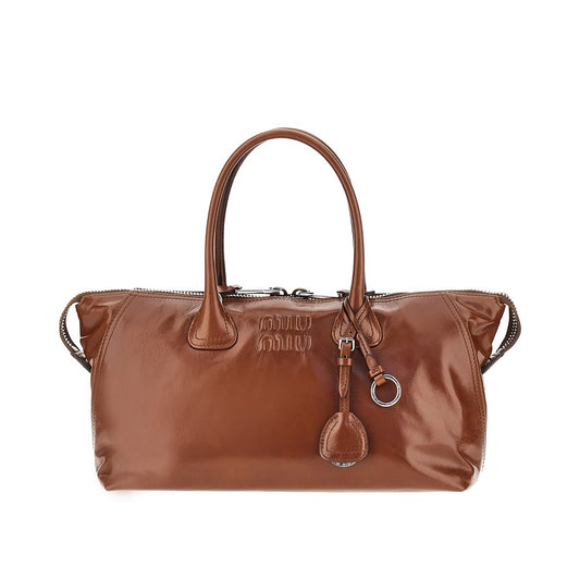 MIU MIU Glossy leather bag with embossed logo