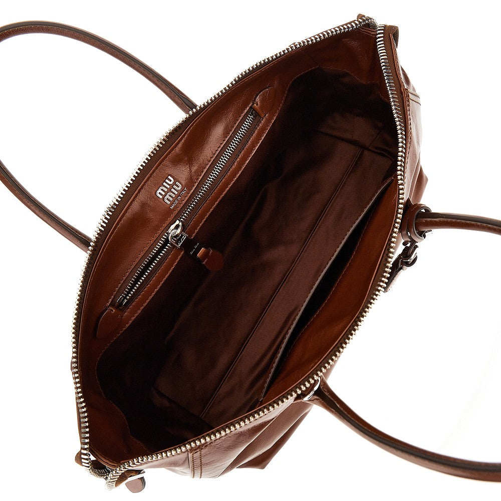 MIU MIU Glossy leather bag with embossed logo