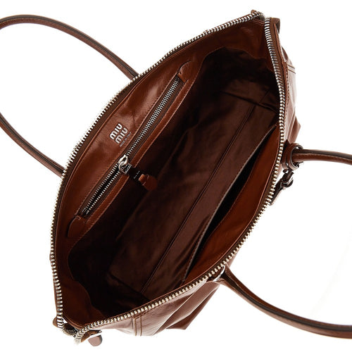 MIU MIU Glossy leather bag with embossed logo