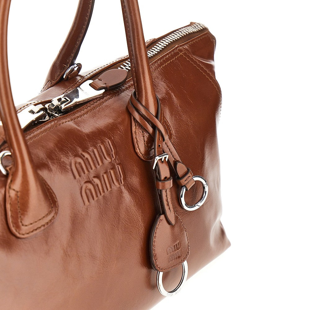 MIU MIU Glossy leather bag with embossed logo