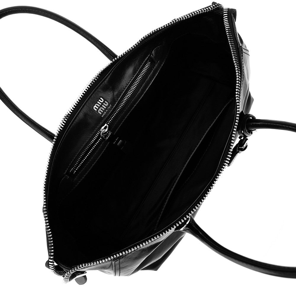 MIU MIU Glossy leather bag with embossed logo