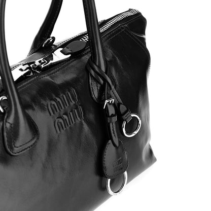 MIU MIU Glossy leather bag with embossed logo