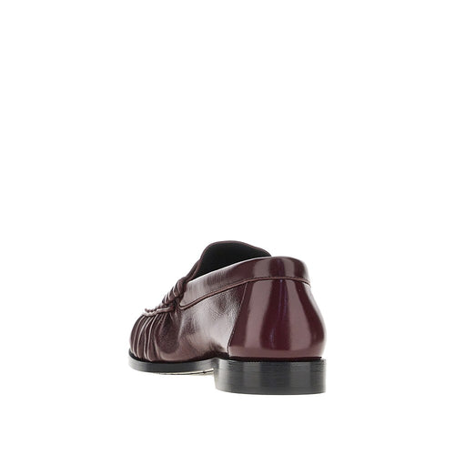 SAINT LAURENT Leather loafers with Cassandre logo