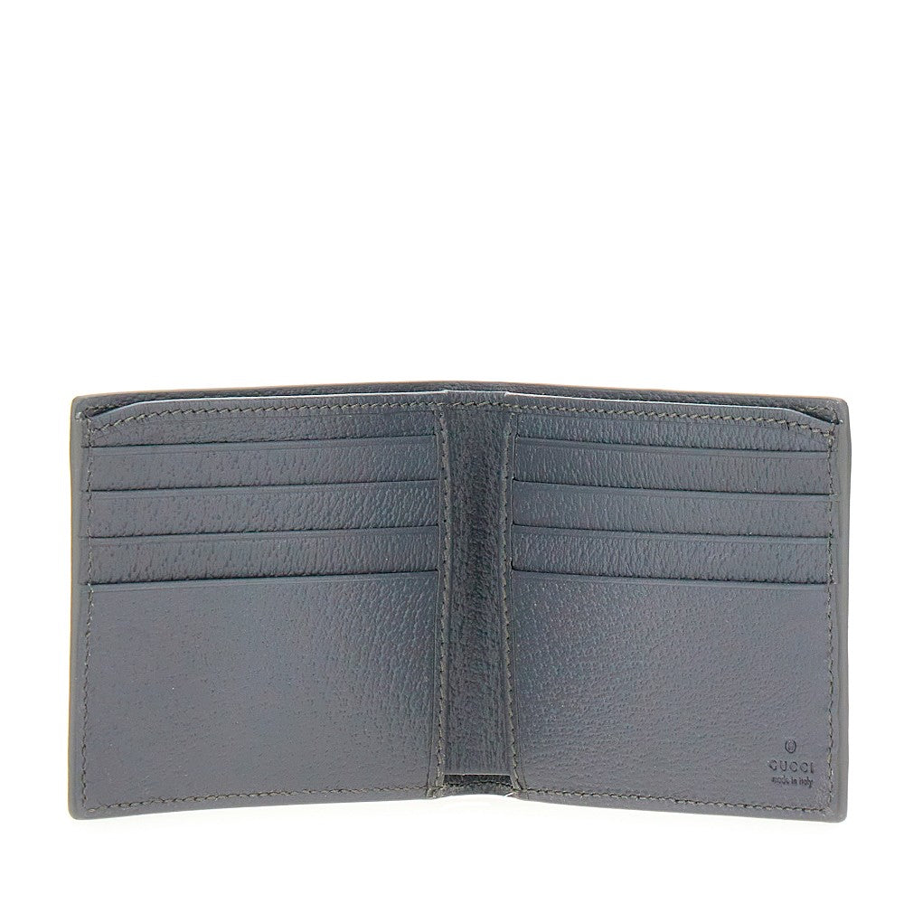 GUCCI Bi-fold wallet with lacquered GG detail