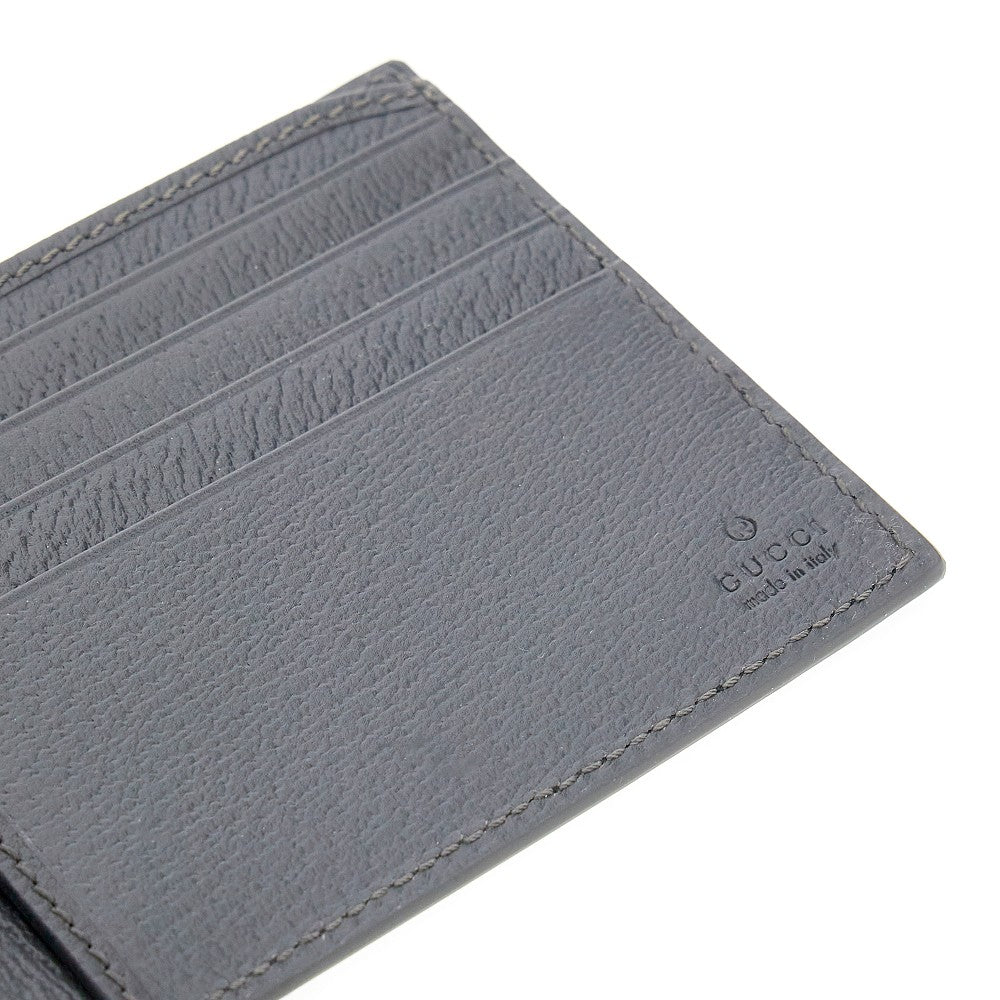GUCCI Bi-fold wallet with lacquered GG detail