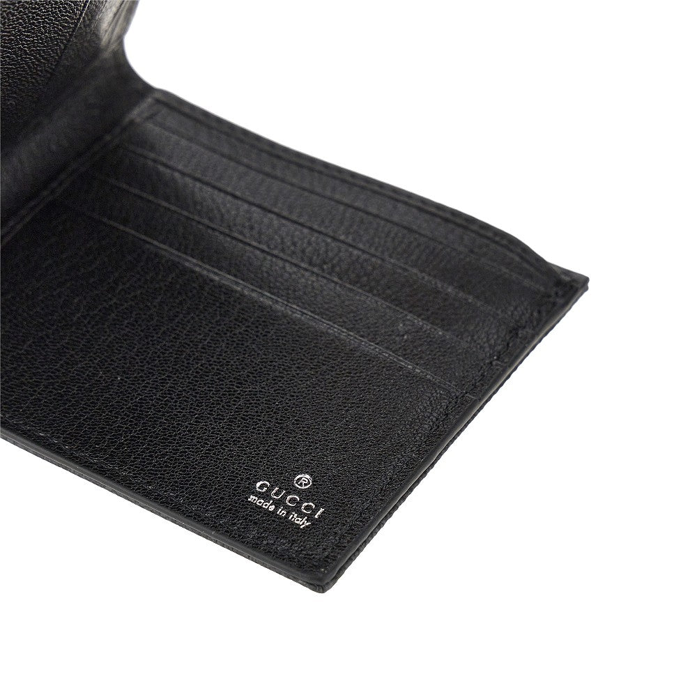 GUCCI Bi-fold wallet with lacquered GG detail